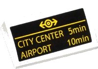 LEGO part Slope, Curved 2 x 4 x 2/3 with Bottom Tubes with Yellow Train Logo, 'CITY CENTER 5min' and 'AIRPORT 10min' Pattern (Sticker) - Set 60050 88930pb046