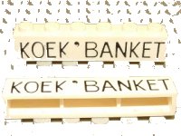 LEGO onderdeel Brick 1 x 6 without Bottom Tubes with Cross Side Supports with Black 'KOEK ' BANKET' Thin Pattern crssprt02pb013