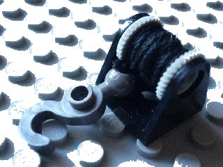 LEGO onderdeel String Reel 2 x 2 Complete with Black String Thin and Dark Gray Hook with Tow Ball (2585 / 2584 / x77a / 30395) (2584c04)