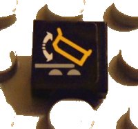 LEGO part Tile 1 x 1 with Dump Truck and Arrows Pattern (Sticker) - Set 8479 3070pb042