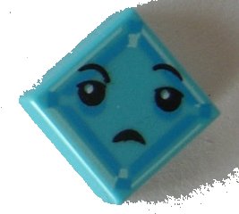 LEGO part Tile 1 x 1 with Black Eyes, Small Frown, Light Aqua and Dark Azure Square Pattern (Kryptomite Face) (3070pb113)