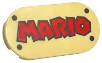 LEGO part Tile, Round 2 x 4 Oval with Red 'MARIO' and Dark Brown Rivets Pattern 66857pb002