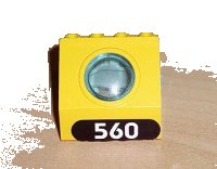 LEGO part Panel 4 x 3 x 3 with Trans-Light Blue Porthole with White '560' in Black Oval Pattern (Sticker) - Set 6560 30080c01pb02