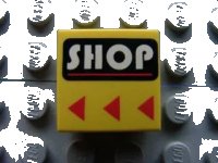 LEGO part Tile 2 x 2 with White 'SHOP' and Red Line on Black Rounded Rectangle, Red Triangles Pattern 3068px29