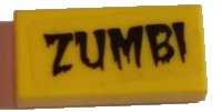 LEGO part Tile 1 x 2 with Black Dripping 'ZUMBI' Pattern (Sticker) - Set 5973 3069pb0437