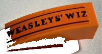 LEGO part Slope, Curved 3 x 1 with Black 'WEASLEYS' WIZ' and Lines Pattern (Sticker) - Set 75978 50950pb147