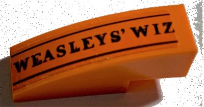 LEGO onderdeel Slope, Curved 3 x 1 with Black 'WEASLEYS' WIZ' and Lines Pattern (Sticker) - Set 75978 (50950pb147)