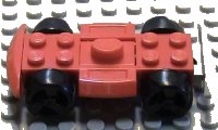 LEGO part Vehicle, Base 4 x 6 Racer Base with Black Wheels and Light Gray Bumper 30558c01