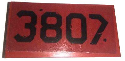 LEGO onderdeel Tile 2 x 4 with Black '3807' Pattern (Sticker) - Set 76947 (87079pb1459)