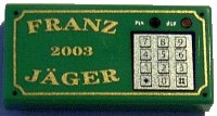 LEGO part Tile 1 x 2 with Gold 'FRANZ JÄGER', '2003', and Silver Numeric Keypad Pattern 3069pb0031