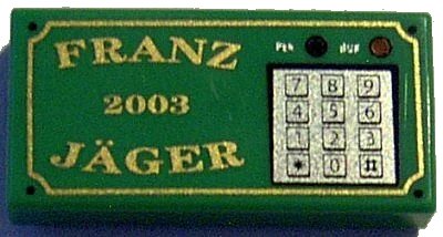 LEGO onderdeel Tile 1 x 2 with Gold 'FRANZ JÄGER', '2003', and Silver Numeric Keypad Pattern (3069pb0031)