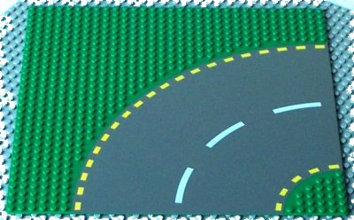 LEGO onderdeel Baseplate, Road 32 x 32 6-Stud Curve with Dark Gray Road with Yellow Dashed Lines Pattern (44342pb01)