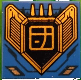 LEGO part Tile 2 x 2 with Dark Blue Lines and Gold and Black Engine with Ninjago Logogram Letter J in Square Pattern (3068pb2168)