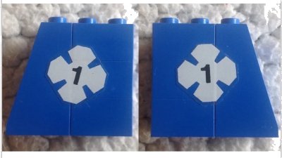 LEGO onderdeel Stickered Assembly 4 x 2 x 3 with White Lucky Clover and Black Number 1 Pattern on Both Sides (Stickers) - Sets 316-1 / 775 - 1 Slope 75 2 x 2, 3 Brick 2 x 2 (BA146pb01)