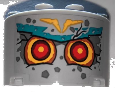 LEGO onderdeel Cylinder Half 2 x 4 x 2 with 1 x 2 Cutout with Stone Face with Red Eyes and Dark Turquoise Eyebrows Pattern (Sticker) - Set 71747 (24593pb11)