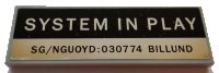 LEGO part Tile 2 x 6 with 'SYSTEM IN PLAY' and 'SG/NGUOYD:030774 BILLUND' Pattern (Sticker) - Set 21327 69729pb010