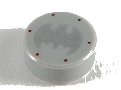 LEGO part Tile, Round 1 x 1 with Silver Bat Batman Logo and 6 Reddish Brown Rivets Pattern (98138pb111)