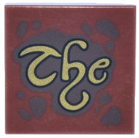 LEGO part Tile 2 x 2 with Dark Brown Spots and Splatters and Gold Script 'The' Pattern 3068pb2659