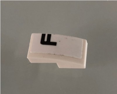 LEGO part Slope, Curved 2 x 1 x 2/3 with Black Letter F on White Background Pattern Model Left Side (Sticker) - Set 42096 (11477pb090L)
