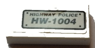 LEGO part Tile 1 x 2 with 'HIGHWAY POLICE HW-1004' Pattern (Sticker) - Set 8152 (3069pb0544)
