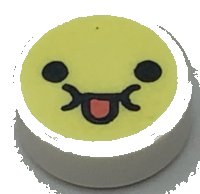 LEGO part Tile, Round 1 x 1 with Emoji, Bright Light Yellow Face, Black Eyes, and Coral Tongue Sticking Out Pattern 98138pb315