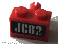 LEGO part Brick, Modified 1 x 2 with Pin with Silver 'JC82' on Black Background Pattern (Sticker) - Set 76006 2458pb01