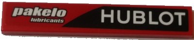 LEGO part Tile 1 x 6 with 'HUBLOT' and 'pakelo lubricants' Pattern Model Right Side (Sticker) - Set 75908 (6636pb151R)