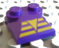 LEGO part Slope, Curved 2 x 2 x 2/3 with 2 Studs and Curved Sides with Yellow Triangle on 3 Bars Pattern 47457pb02
