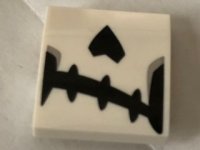LEGO part Slope, Curved 2 x 2 x 2/3 with Skeletal Mouth and Nose Pattern 15068pb127