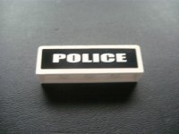 LEGO part Panel 1 x 4 x 1 with White 'POLICE' on Black Background Pattern (Sticker) - Set 7236-1 30413pb019