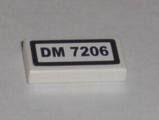 LEGO part Tile 1 x 2 with 'DM 7206' Pattern (Sticker) - Set 7206 (3069pb0115)