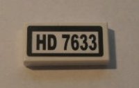 LEGO part Tile 1 x 2 with Black 'HD 7633' on White Background Pattern (Sticker) - Set 7633 3069pb0129
