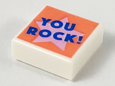 LEGO part Tile 1 x 1 with Blue 'YOU ROCK!' on Bright Pink Star on Coral Background Pattern (3070pb148)