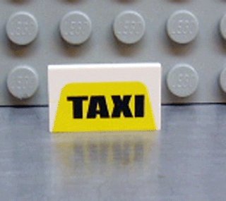 LEGO part Panel 1 x 2 x 1 with 'TAXI' on Yellow Pattern (4865px9)