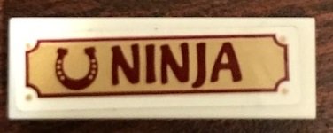 LEGO part Tile 1 x 3 with Horseshoe and 'NINJA' Pattern (Sticker) - Set 41126 (63864pb082)