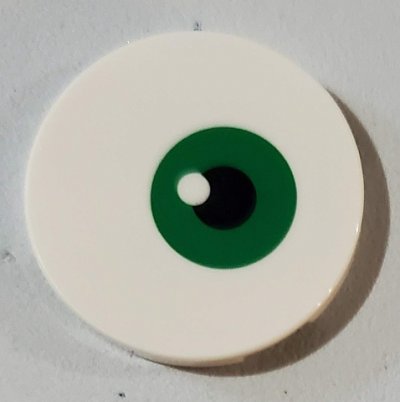 LEGO part Tile, Round 3 x 3 with Green and Black Eye Pattern (67095pb001)