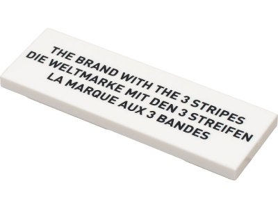 LEGO part Tile 2 x 6 with Black 'THE BRAND WITH THE 3 STRIPES', 'DIE WELTMARKE MIT DEN 3 STREIFEN', and 'LA MARQUE AUX 3 BANDES' Pattern (69729pb006)