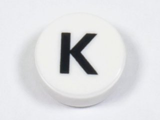 LEGO part Tile, Round 1 x 1 with Black Capital Letter K Pattern (98138pb221)