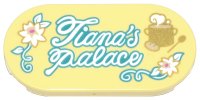 LEGO part Tile, Round 2 x 4 Oval with White and Gold Flowers and Cooking Pot with Steam, Dark Turquoise Vines, Leaves, and Script 'Tiana's Palace' Pattern 66857pb059