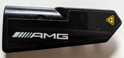 LEGO part Technic, Panel Fairing #21 Very Small Smooth, Side B with White 'AMG' Logo and Yellow Electricity Warning Triangle Pattern (Sticker) - Set 42165 (11946pb106)