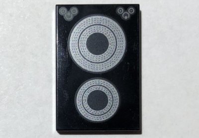 LEGO part Tile 2 x 3 with Silver Concentric Circles Stove Plate Pattern (26603pb185)