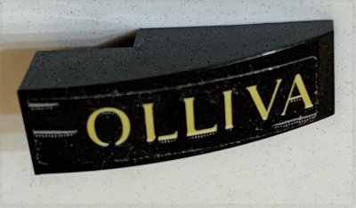 LEGO part Slope, Curved 3 x 1 with 'OLLIVA' Pattern (Sticker) - Set 75978 (50950pb140)