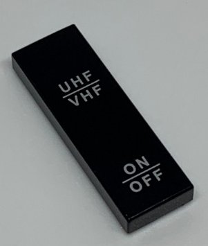 LEGO part Tile 1 x 3 with 'UHF/VHF' and 'ON/OFF' Pattern (63864pb115)