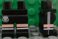 LEGO part Hips and Legs with DFB Logo with 4 Stars, Light Nougat and White Stripes, Lines on Sides Pattern 970c00pb0544
