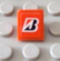 LEGO part Slope 30 1 x 1 x 2/3 with Red and Black Letter B Pattern (Sticker) - Sets 8168 / 8185 54200pb002