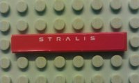 LEGO part Tile 1 x 6 with White 'STRALIS' on Red Background Pattern (Sticker) - Set 8654 6636pb055