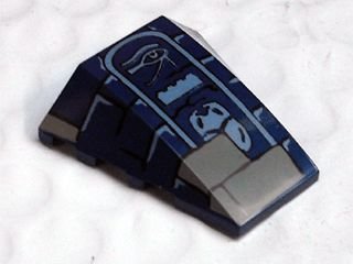 LEGO part Wedge 4 x 4 Triple Curved No Studs with Dark Tan Bricks and Light Bluish Gray Eye of Horus, LEGO Brick, and Scarab Hieroglyphs Pattern (47753pb020)