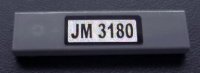 LEGO part Fliese 1 x 4 mit schwarzem 'JM 3180' Muster auf weißem Hintergrund (Aufkleber) - Set 3180 2431pb0099