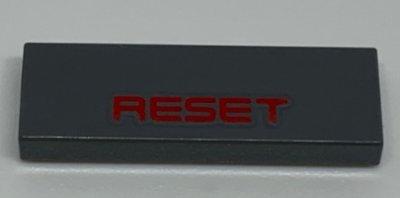 LEGO part Tile 1 x 3 with Red 'RESET' Pattern (63864pb113)