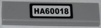 LEGO part Tile 1 x 4 with Black 'HA60018' on White Background Pattern (Sticker) - Set 60018 2431pb0284